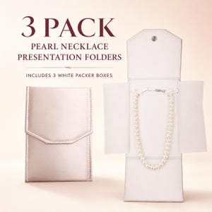 May include: A 3 pack of pearl necklace presentation folders in a light champagne color. One folder is shown closed, while another is open, displaying a white pearl necklace secured inside. The text reads 3 PACK PEARL NECKLACE PRESENTATION FOLDERS.