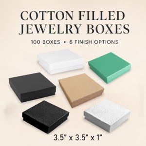 May include: Six square cotton-filled jewelry boxes in white, green, black, kraft brown, textured black, and textured white. The text reads COTTON FILLED JEWELRY BOXES, 100 BOXES, 6 FINISH OPTIONS, and 3.5" x 3.5" x 1".