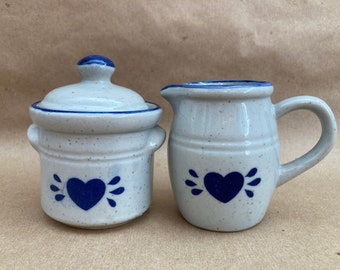 Vintage blue stoneware creamer and sugar bowl set with heart decoration