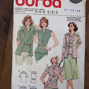 Peut inclure: Un patron de couture Burda vintage, présentant des illustrations de modèles de vêtements pour femmes. Le patron comprend différents styles de hauts, de vestes et de jupes. Le numéro 70475 et les informations de taille sont sur la couverture.