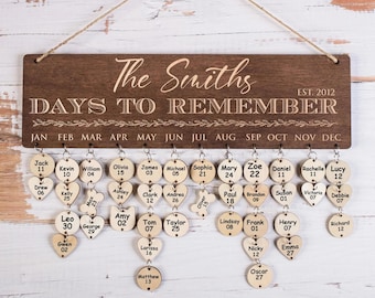 May include: A wooden sign with the text "The Smiths EST. 2012 DAYS TO REMEMBER" and a calendar with names and dates on wooden circles and hearts.
