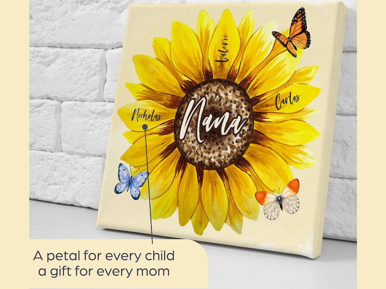May include: A canvas print featuring a large yellow sunflower with the word "Nana" in the center. The sunflower has the names "Nicholas", "Valerie", and "Carlos" on the petals. Butterflies are also featured. The text reads: "A petal for every child, a gift for every mom."