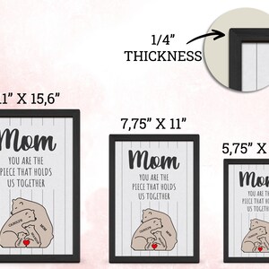 May include: A black framed print with a white background and gray stripes. The print features a bear family with the text "Mom You are the piece that holds us together". The print is available in three sizes: 11 inches by 15.6 inches, 7.75 inches by 11 inches, and 5.75 inches by 8.75 inches.