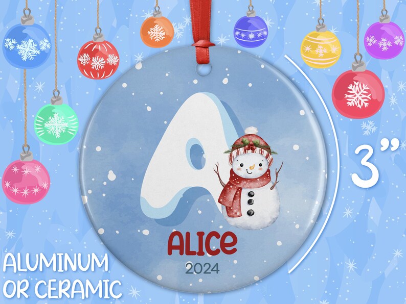 May include: A blue and white Christmas ornament with a snowman and the letter A. The ornament is 3 inches in diameter and says "Alice 2024".