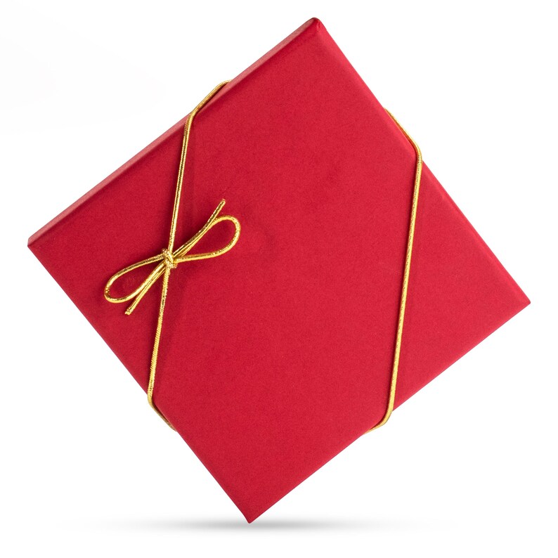 May include: A red gift box with a gold ribbon tied in a bow.