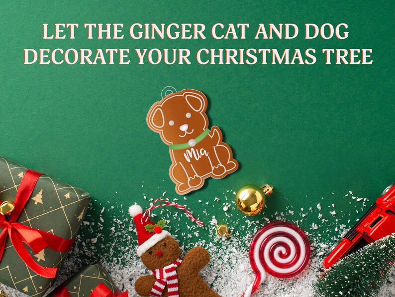 May include: Gingerbread ornament shaped like a dog with the name "Mia" written on it. The ornament is surrounded by Christmas decorations, including a gingerbread person, a candy cane, and a red toy car.