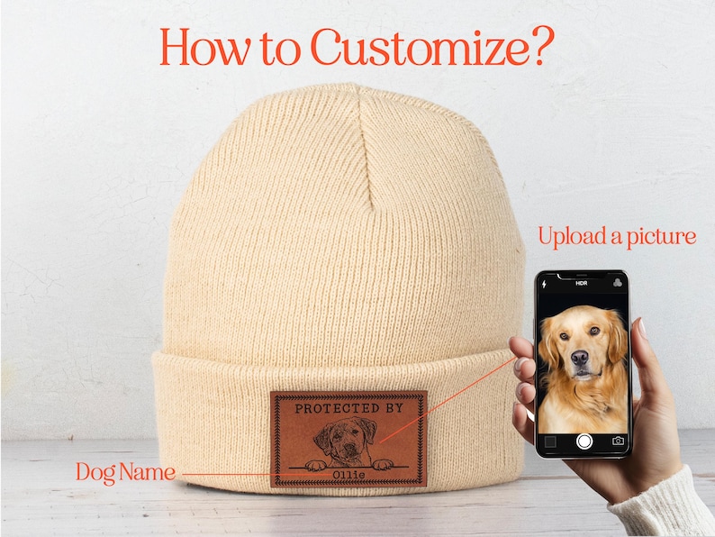 May include: A beige knitted beanie with a brown leather patch that says "Protected by" and has a space for a dog's name and picture. The text "Upload a picture" is visible above a smartphone displaying a golden retriever.