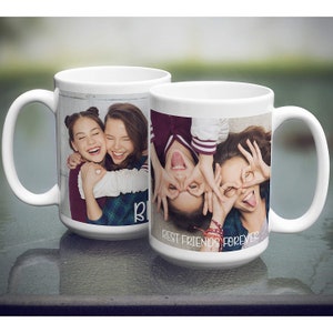 May include: Two white ceramic mugs with images of two friends on them. The mug on the left shows the friends hugging and the mug on the right shows the friends making silly faces with their hands over their eyes. The text "Best Friends Forever" is printed on the mug on the right.