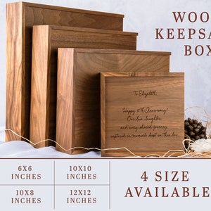 May include: Four wooden keepsake boxes in different sizes, ranging from 6x6 inches to 12x12 inches. The smallest box is on the left, and the largest box is on the right. The boxes are made of a dark wood with a natural grain. The largest box has a personalized inscription on the lid that reads "To Elizabeth, Happy 5th Anniversary! Our love, laughter, and every shared journey, captured in moments kept in this box."
