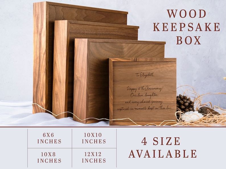 May include: Four wooden keepsake boxes in different sizes, ranging from 6x6 inches to 12x12 inches. The smallest box is on the left, and the largest box is on the right. The boxes are made of a dark wood with a natural grain. The largest box has a personalized inscription on the lid that reads "To Elizabeth, Happy 5th Anniversary! Our love, laughter, and every shared journey, captured in moments kept in this box."