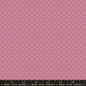May include: Pink fabric featuring a repeating pattern of small, dark purple plus signs. A ruler along the bottom edge displays the text "RUBY STAR SOCIETY". The fabric is suitable for various craft projects.