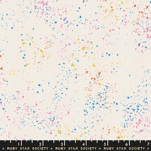 May include: Off-white fabric with a colorful splatter pattern. The design features scattered dots in blue, pink, yellow, and orange. The text "RUBY STAR SOCIETY" is printed at the bottom.