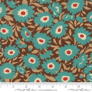 May include: A fabric swatch featuring a repeating floral pattern with teal blue flowers, cream-colored centers, and bright red dots. The background is a dark brown with light tan leaves. A white ruler at the bottom shows 6.5 inches.