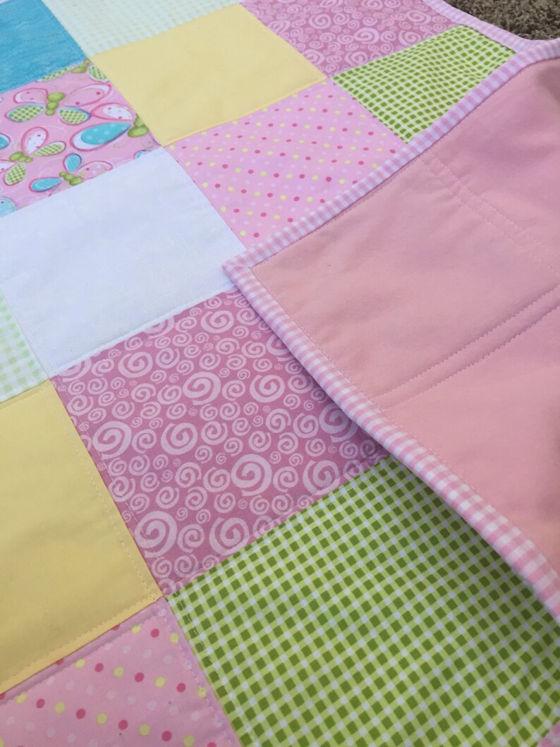 Bright Owls baby quilt in pink teal white and lime green yellow