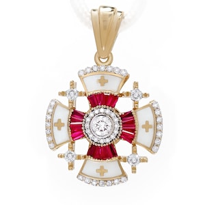 May include: A gold pendant in the shape of a cross, featuring a central red design with a large, round, clear gemstone. The cross has white enamel sections with small crosses and is accented with numerous small, clear gemstones. The pendant hangs from a white cord.