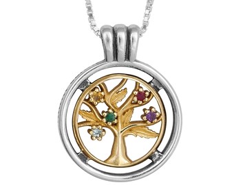 May include: A silver and gold necklace with a round pendant featuring a stylized tree with five gemstones. The gemstones are yellow, green, white, red, and purple.
