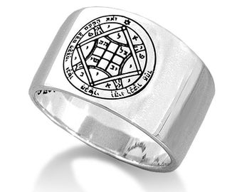 May include: A silver ring with a square design and Hebrew text engraved on the top. The ring is wide and has a flat band.