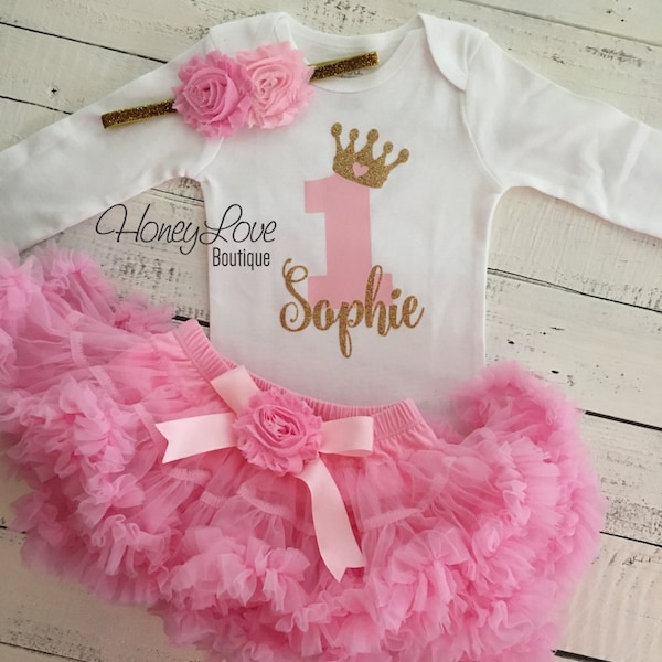 Personalized 1st Birthday outfit, one number 1 tiara crown princess gold glitter shirt bodysuit, light pink tutu skirt, flower headband set