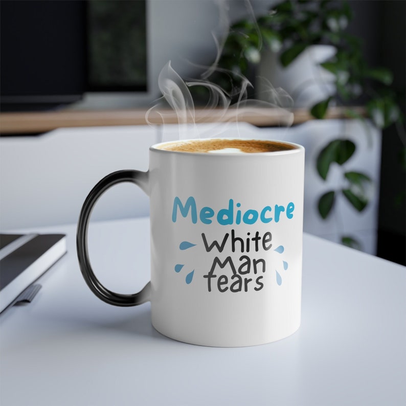 May include: White ceramic mug with a black handle. The mug has a blue and black design that says "Mediocre White Man Tears".