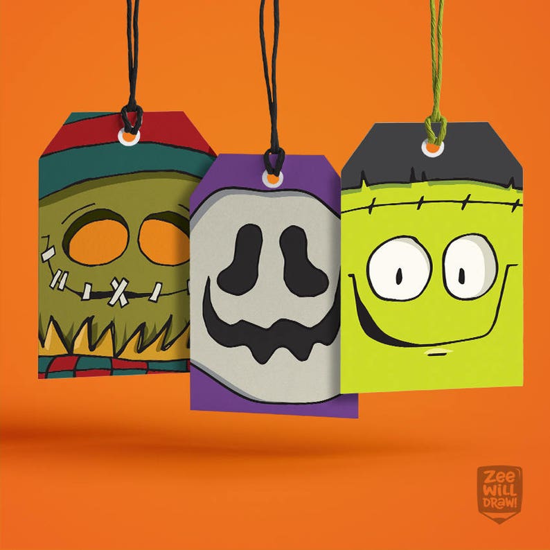May include: Three Halloween-themed gift tags with black string. The tags feature cartoon faces of a zombie, a ghost, and Frankenstein's monster. The zombie tag is green, the ghost tag is purple, and the Frankenstein tag is lime green. The background is orange.
