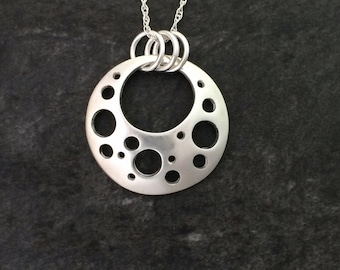 Round Pendant with Holes in Fine Silver , Handmade in solid 999 fine silver, a beautiful pendant with a quirky hole design.