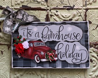 It’s a Farmhouse Christmas hand painted Wood Sign, Red Farm truck , wreath and felt flowers, gray and white ribbon, Buffalo check on a wire