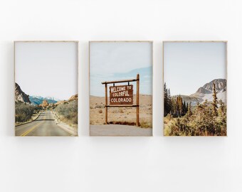 May include: Three framed photographs of scenic landscapes in Colorado. The first photo shows a road winding through a mountainous landscape. The second photo shows a wooden sign that reads "Welcome to Colorful Colorado". The third photo shows a mountain range with trees in the foreground.
