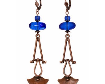 Rich Nile blue glass meets warm antiqued copper in these handcrafted artisan earrings.