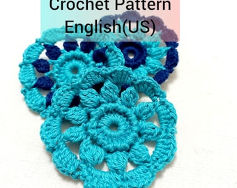 May include: Crochet pattern in English (US) for a blue and dark blue flower motif.