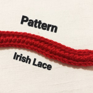 May include: A close-up of a red crocheted Irish lace pattern. The text "Pattern" and "Irish Lace" is visible below the crocheted piece.