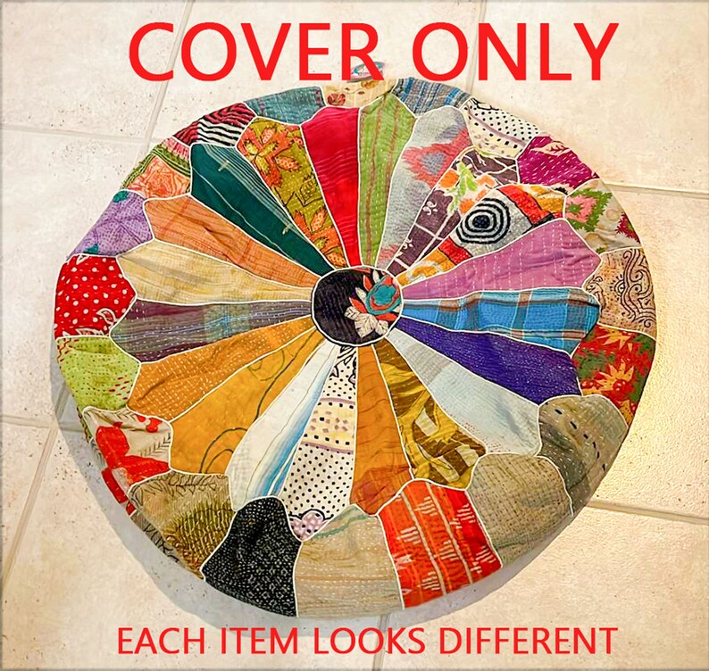 May include: A round, multi-colored patchwork cushion cover with a circular design in the center. The cover is made of various fabrics and colors, including red, green, blue, yellow, and purple. "COVER ONLY" is written in red at the top of the image. "EACH ITEM LOOKS DIFFERENT" is written in red at the bottom of the image.