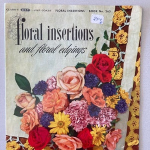 May include: A vintage book titled "Floral Insertions and Floral Edgings" with a price tag of 25¢. The cover features a bouquet of colorful flowers, including roses, carnations, and daisies, arranged on a crocheted doily.