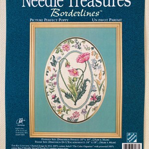 May include: A cross-stitch kit by Needle Treasures, featuring a floral design with pink poppies. The kit includes a framed oval design with the text "Picture Perfect Poppy". Finished size is 10" x 14".