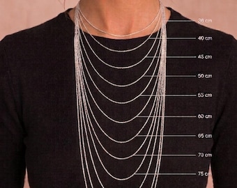 May include: A series of silver-toned metal chains worn around the neck, displayed in varying lengths from 36 cm to 90 cm. Each chain is labeled with its corresponding metric length, providing a clear visual guide for sizing and layering options.