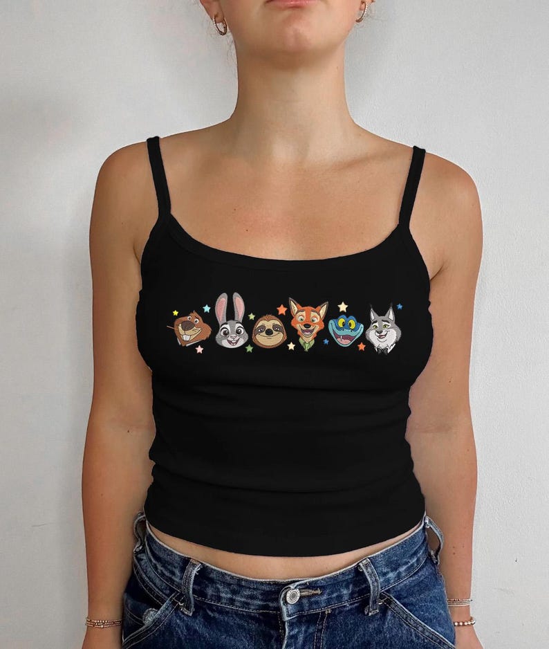 May include: Black spaghetti strap tank top featuring colorful cartoon character faces. The design includes a beaver, rabbit, sloth, fox, frog, and wolf. The tank top is made of a soft, comfortable material.
