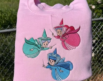 Sleeping Beauty Three Good Fairies Embroidered T-Shirt, Flora Fauna Merryweather Sweatshirt, Disney Princess Fairies Hoodie, Disney Fan Tee