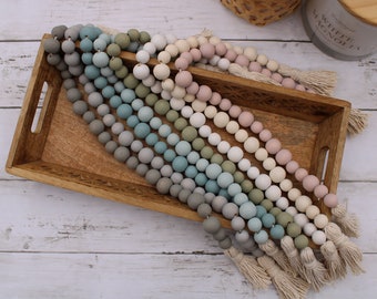 Wood bead garland with tassles, modern farmhouse nursery decor, tiered tray boho decor, white cream, blush pink, blue gray and green garland