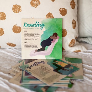 May include: A set of illustrated cards with tips for labour positions. The cards feature a pregnant person in different positions, including kneeling and squatting. The cards have a watercolour background with a teal, green, and pink colour scheme. The text on the cards reads "Kneeling" and "Squatting".
