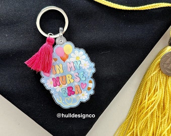 Nurse Era Keychain (Tassel Color Varies), Graduation Keychain, Graduation Era Keychain, Floral Keychain, Retro Keychain,  2.25 x 2.2 in.