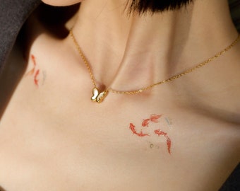 Tatuaje temporal de pez dorado 3