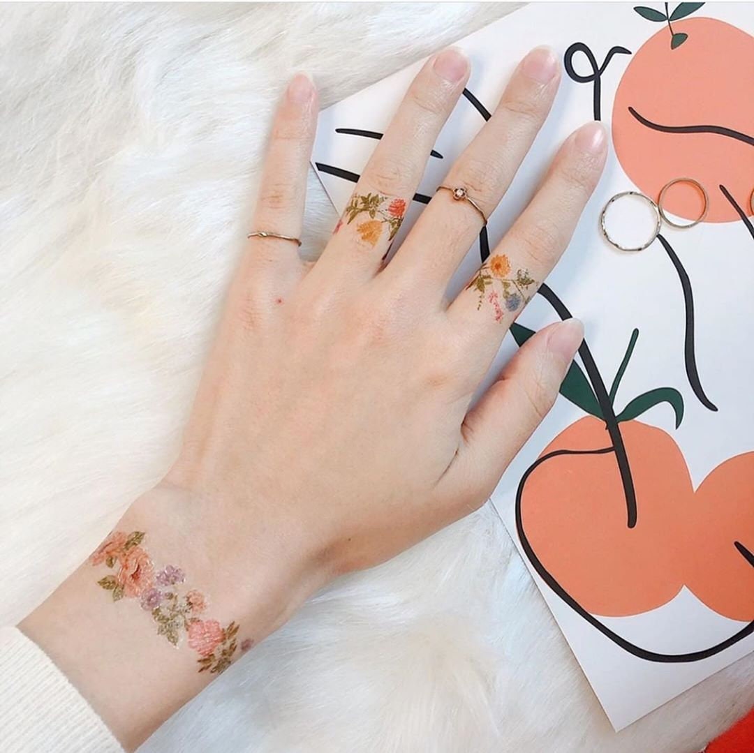 Flower ring finger tattoos sale