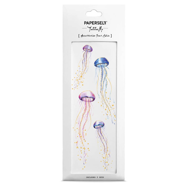 The product in its white PAPERSELF packaging. The design includes four jellyfish of varying sizes, in purple, pink and blue, and gold speckles trailing off their tentacles.