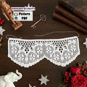May include: A white, intricately crocheted lace piece with a scalloped edge. The image includes a decorative key, a wooden nutcracker, and text that reads "CROCHET BY PATTY" and "Pattern PDF".