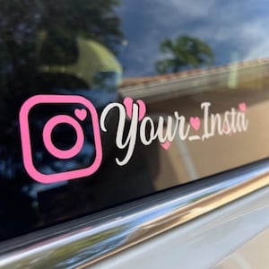 May include: Pink Instagram logo decal with the text "Your_Insta" in white cursive with pink hearts.