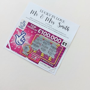 May include: A pink and white lottery ticket with the text "Top Prizes of &pound;100,000" and "With a Bonus Game!" The ticket has a scratch-off area and a matching game.