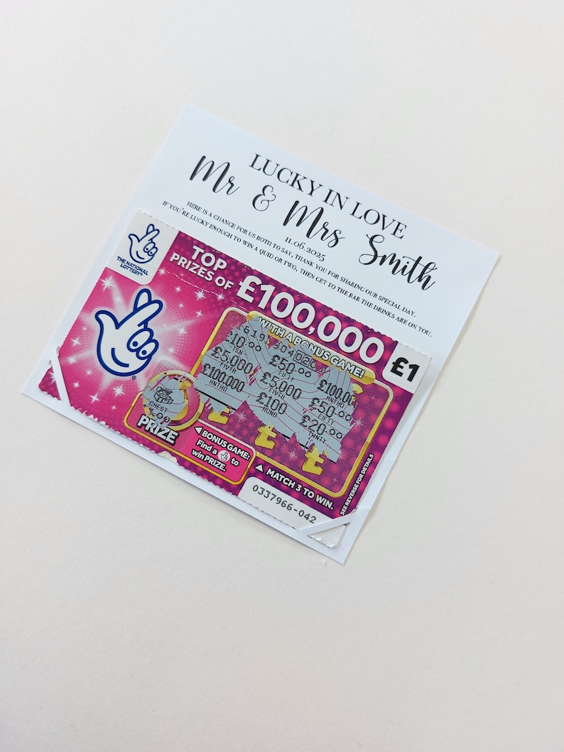 May include: A pink and white lottery ticket with the text "Top Prizes of &pound;100,000" and "With a Bonus Game!" The ticket has a scratch-off area and a matching game.