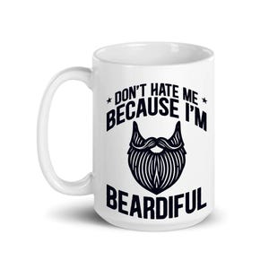 May include: White ceramic coffee mug with a black design that says "Don't hate me because I'm Beardifull" with a stylized beard graphic.