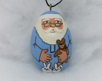 Santa with glasses in Light Blue PJs, bunny slippers wooden hanging ornament egg