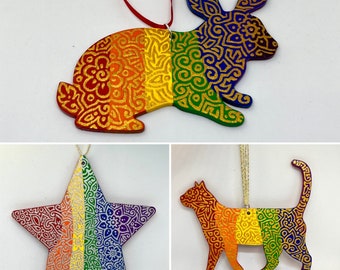 Rainbow flat wooden Ornament with metallic hand painted design.