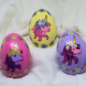 Unicorn wooden egg with flowers Easter or Christmas